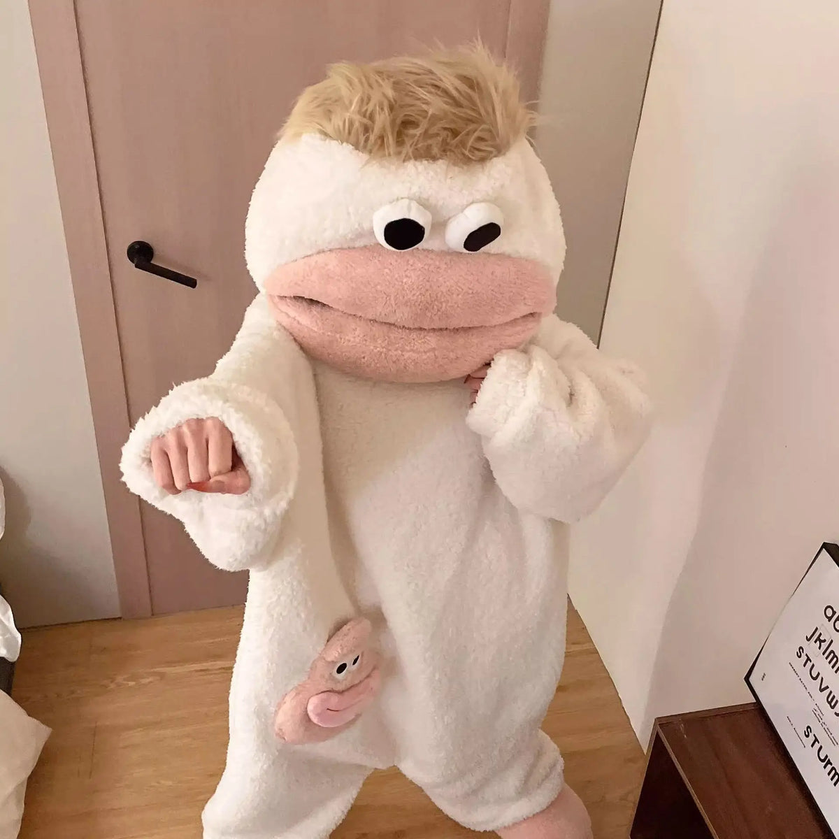 Cream Big Mouth Monster onesie with tan hair and pink mouth